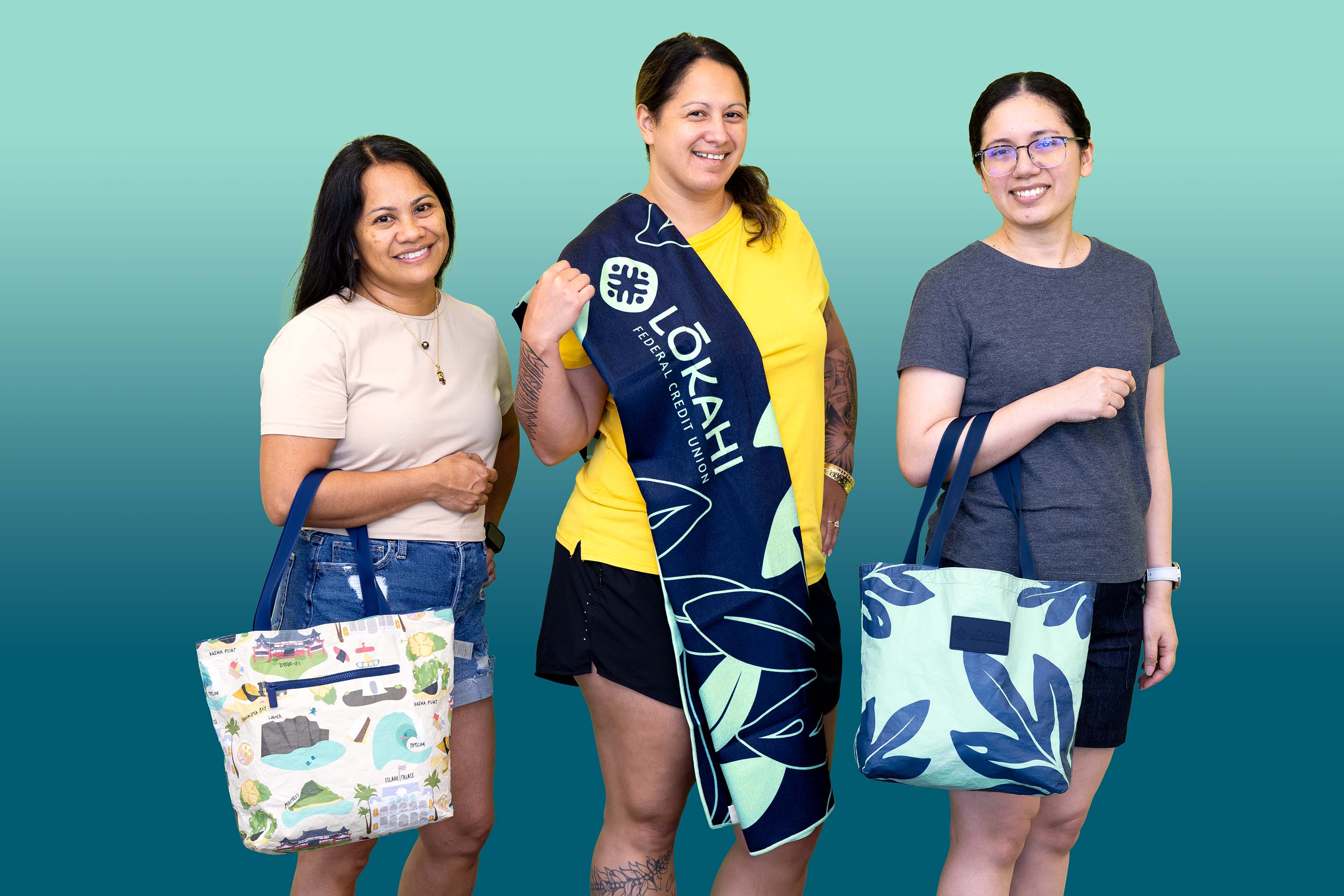 staff members holding premium logo items