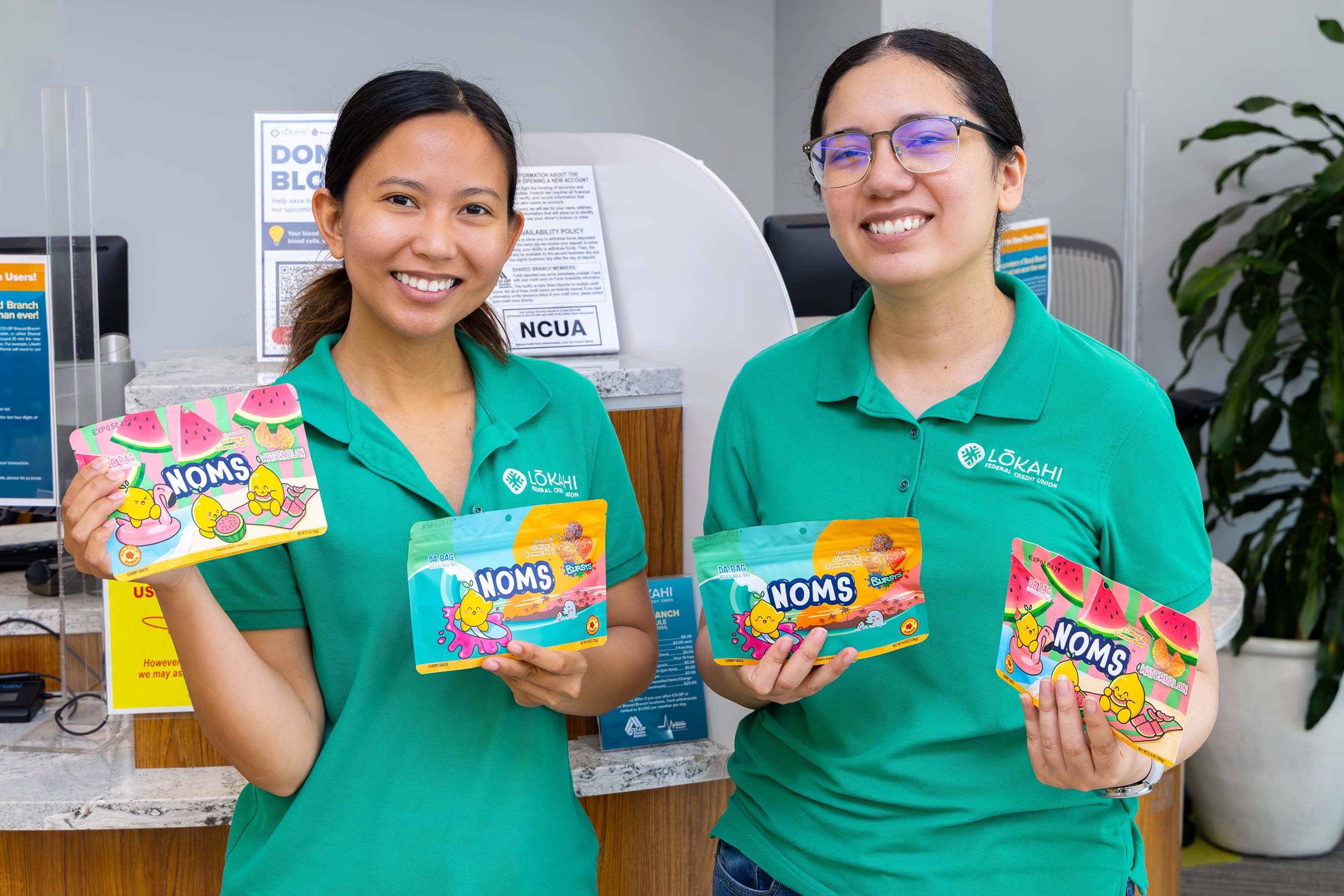 Lōkahi FCU holding bags of fundraiser-size NOMS
