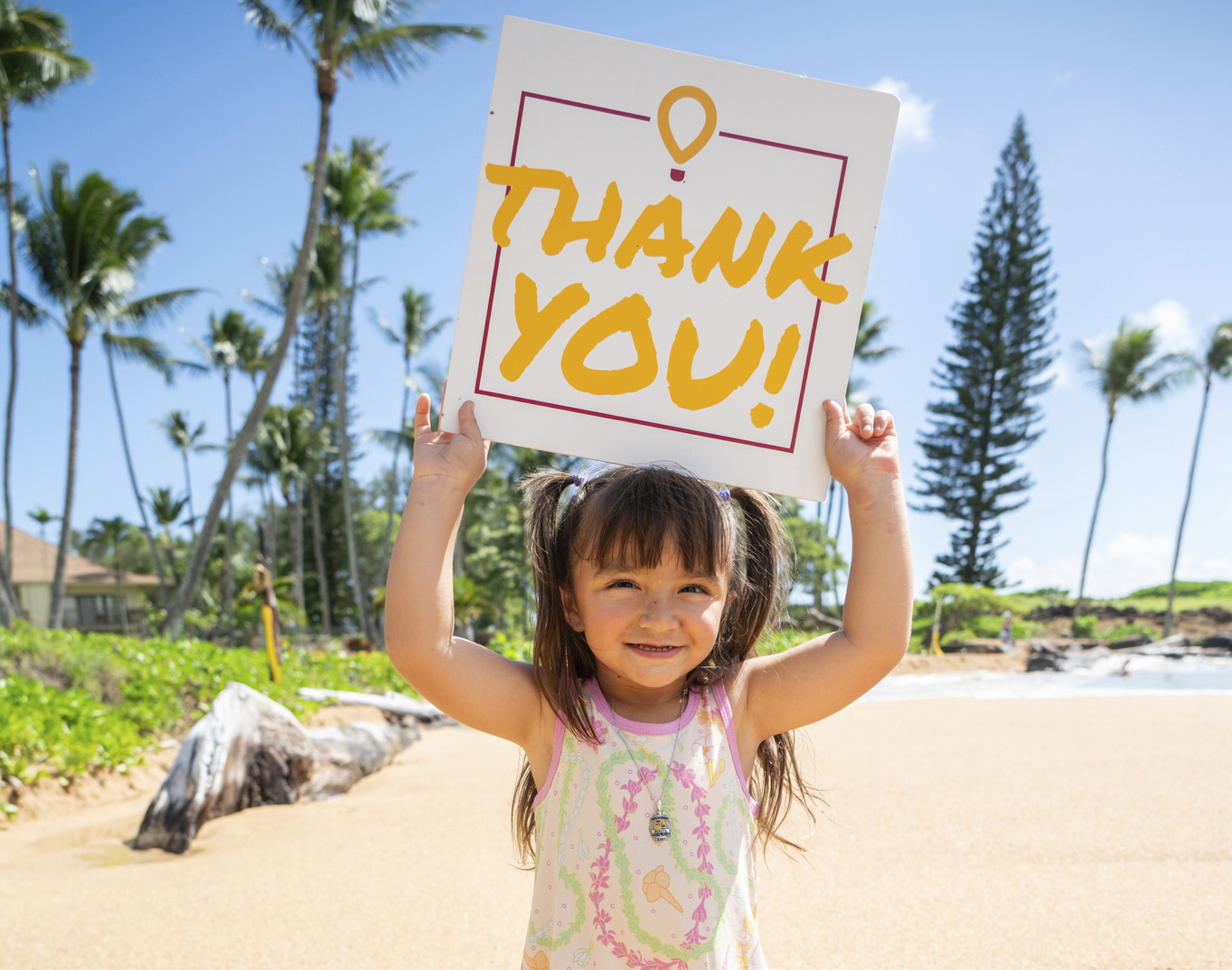 Seeley Borges holding a thank you sign