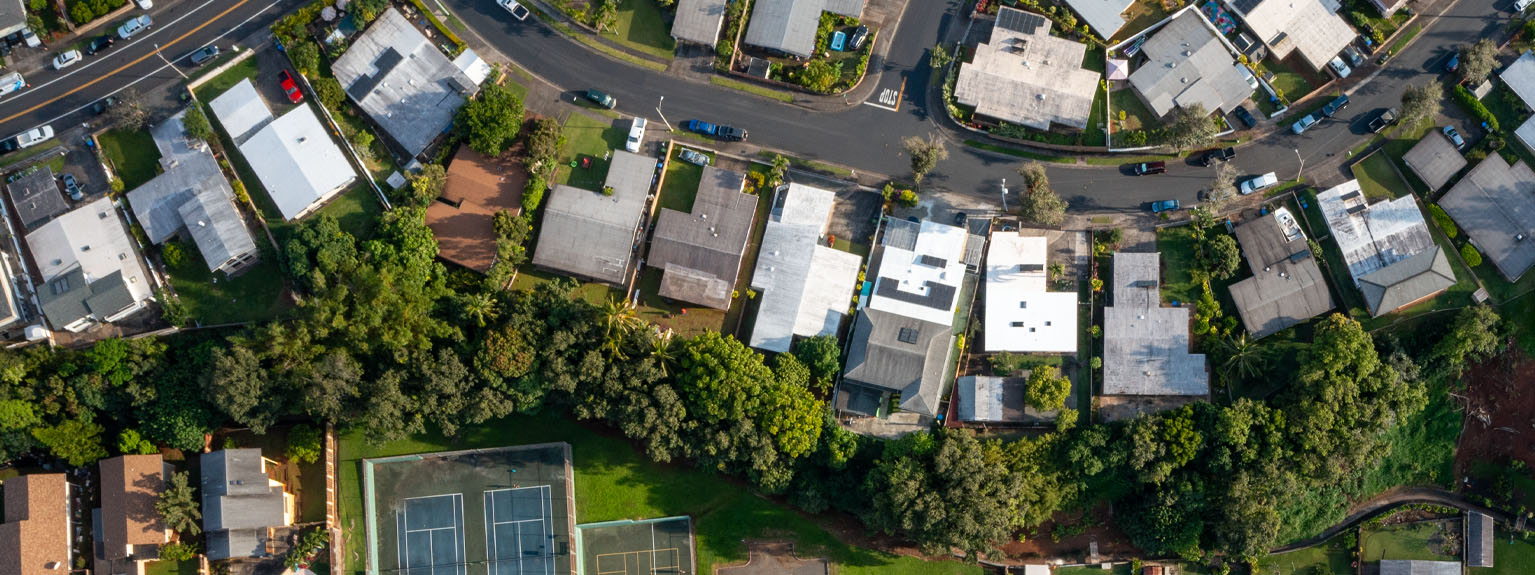 aerial neighborhood photo featuring a home with PV